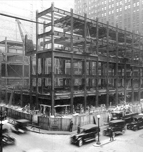 Steel framework is visible during an early stage of construction of the Chicago Fed building.