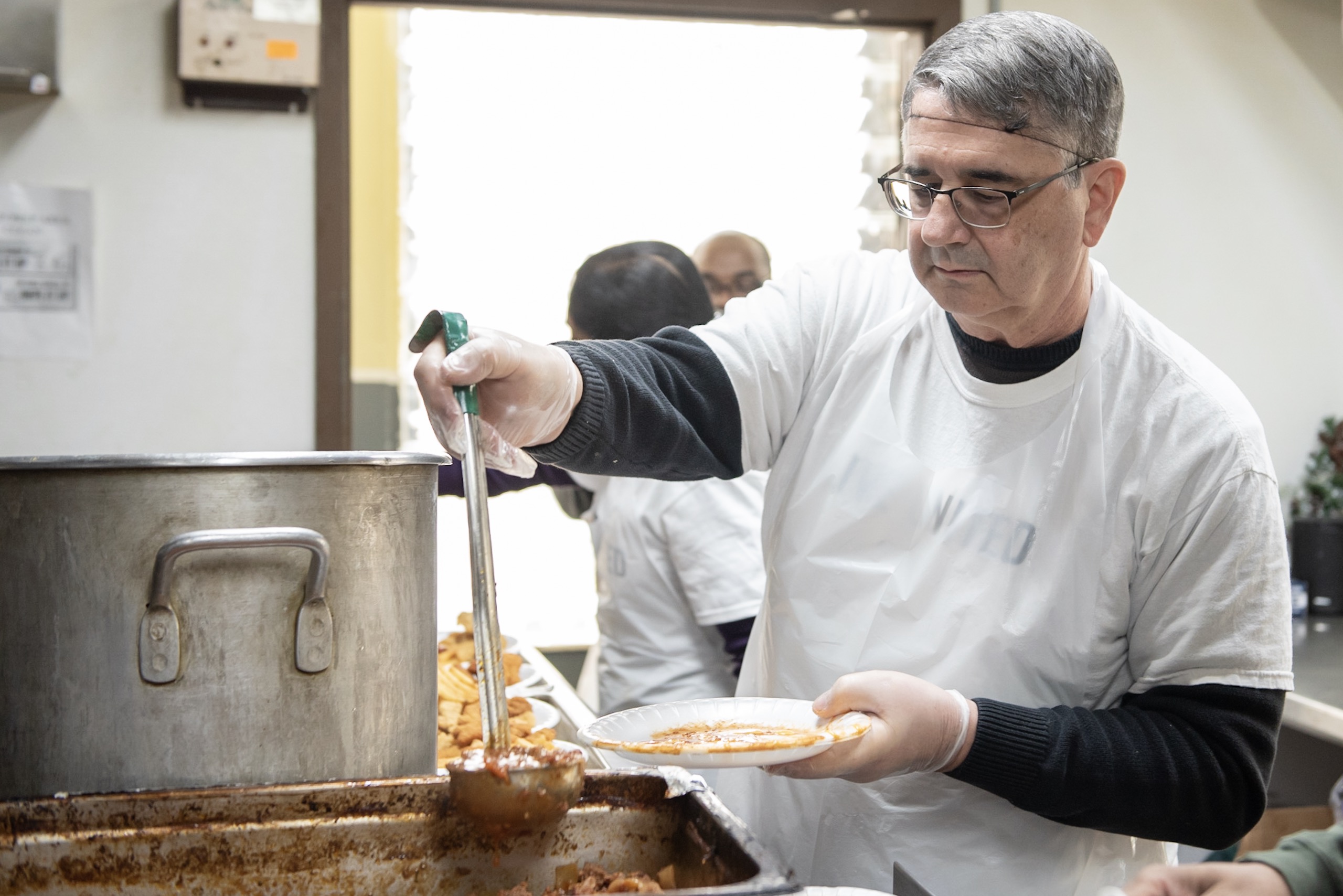 Detroit Branch employee shown volunteering serving food