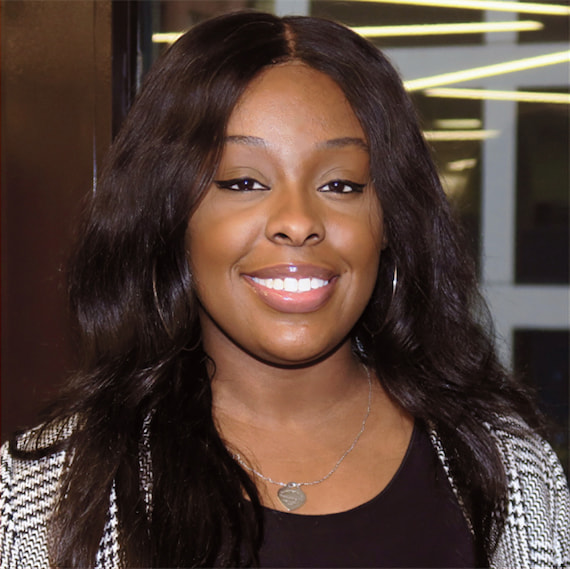 A smiling portrait of employee Dimiya Martin.