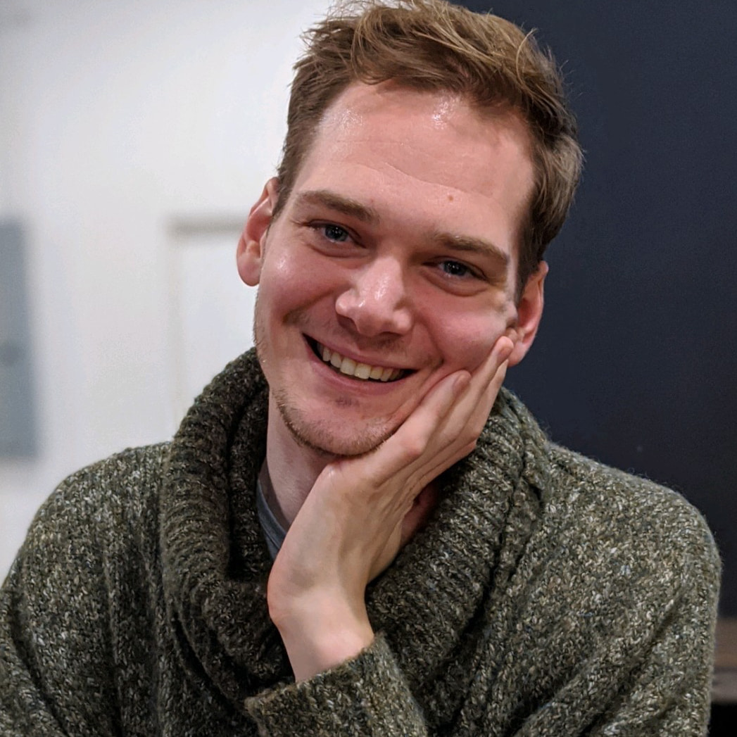 A smiling portrait of employee Blake Kelley.
