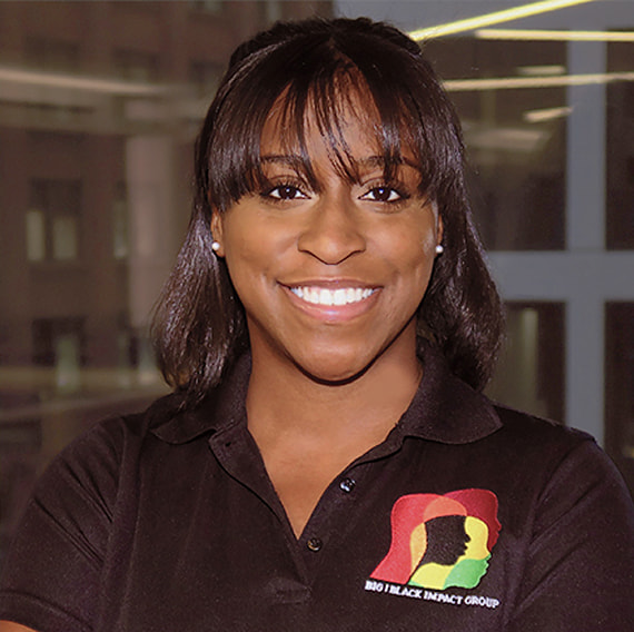 A smiling photo of Stephanie Wormack. She is wearing a polo shirt featuring the Black Impact Group logo.