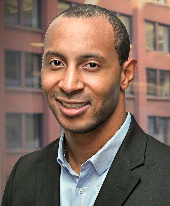 A smiling photo of Devin Patterson, a central bank services credit risk manager at the Chicago Fed, who was named a 2020 Working Father of the Year.