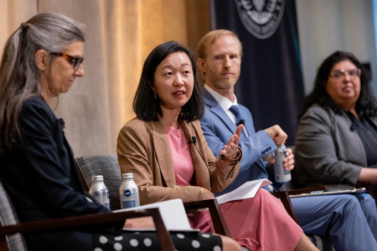 Panelists seated onstage during the Fed Listens event.