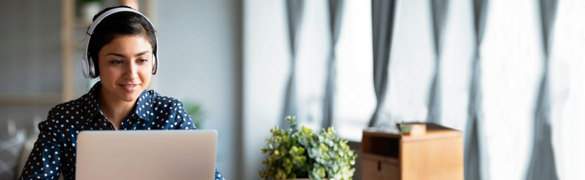Woman talks on the phone and provides tech support
