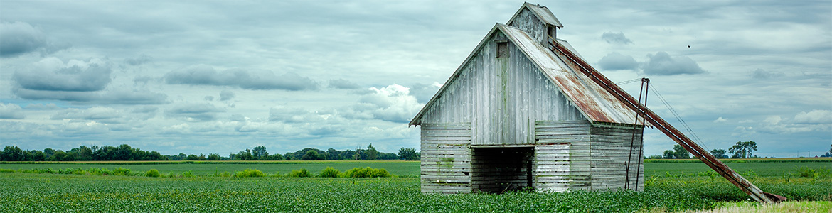 A barn in a field.