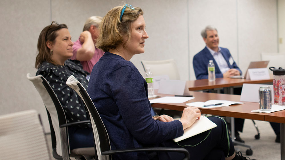 Economists participating in roundtable discussion.