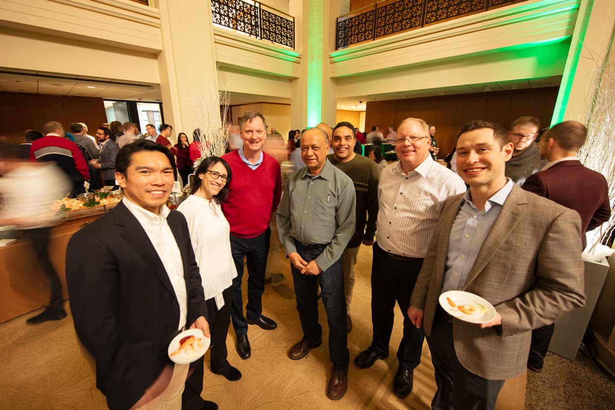 Staff and Bank President and CEO, Charlie Evans, at 2019 Holiday Party